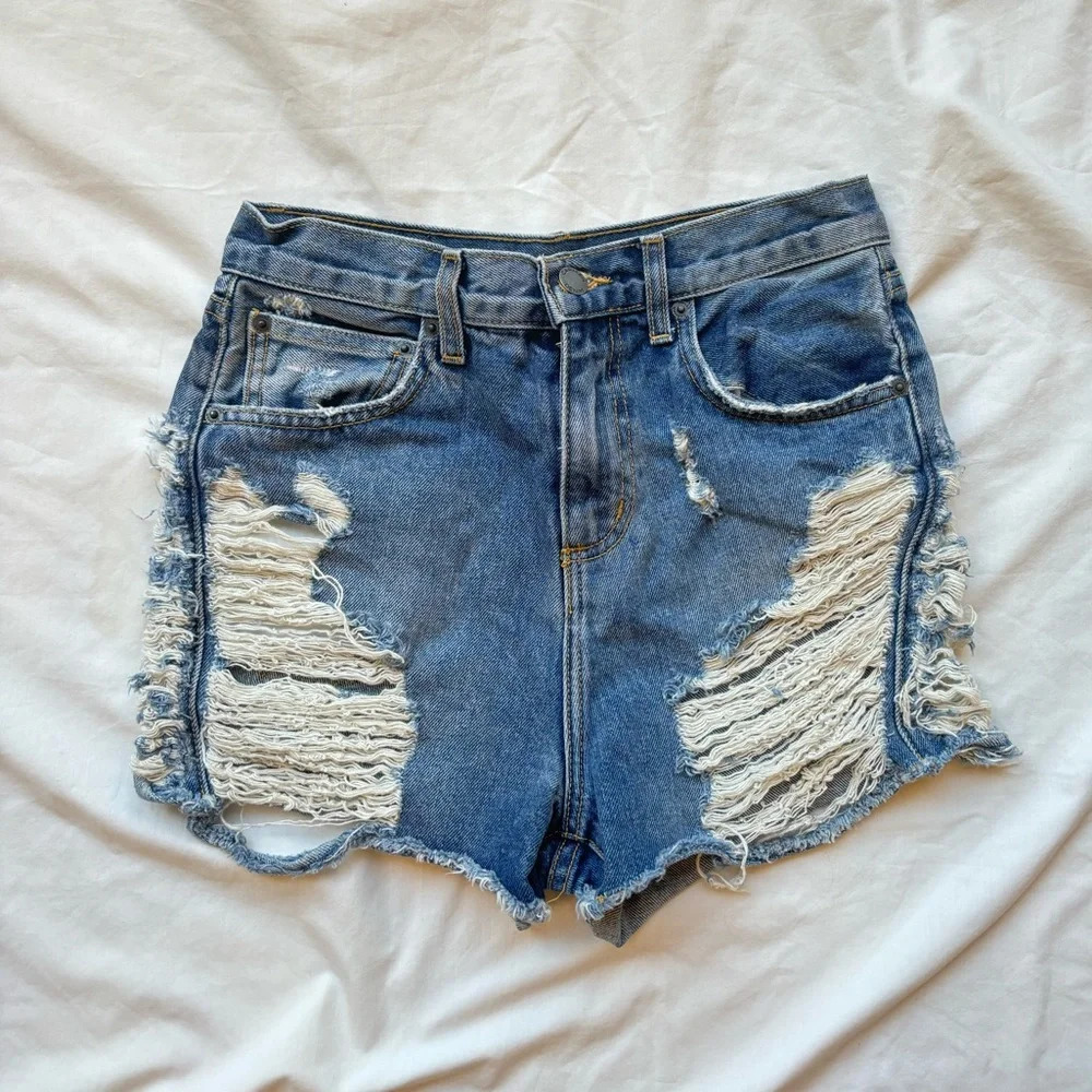 Carmar by LF NWOT heavily Distressed denim shorts with a raw hem